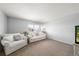 A bright living room with plush sofas and a large window offering natural light at 2153 Mountain Iris Dr, Erie, CO 80516