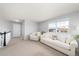 A bright living room with plush sofas and a large window offering natural light at 2153 Mountain Iris Dr, Erie, CO 80516