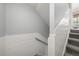 Staircase with carpeted steps and white wainscoting, blending functionality with aesthetic appeal at 2153 Mountain Iris Dr, Erie, CO 80516