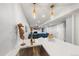 Interior of the Wet Bar with stainless sink, modern pendant lights, and views of the living room at 2153 Mountain Iris Dr, Erie, CO 80516