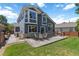 Spacious backyard featuring a large patio area with outdoor dining set, ideal for entertaining at 2261 Alpine Dr, Erie, CO 80516