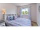 This charming bedroom features a cute window view and ample natural light at 2261 Alpine Dr, Erie, CO 80516