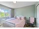 A sunlit bedroom showcases a cozy rocking chair and relaxing atmosphere at 2261 Alpine Dr, Erie, CO 80516