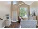 Bright living room with high ceilings, large windows, and stylish decor with hardwood floors at 2261 Alpine Dr, Erie, CO 80516