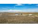 Aerial view of a ranch style home with detached garage and expansive land at 43343 E Arkansas Pl, Bennett, CO 80102