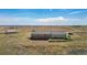 Aerial view of ranch home and detached shop on acreage at 43343 E Arkansas Pl, Bennett, CO 80102