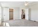 Bright bedroom with carpet floors, walk-in closet, and an ensuite bathroom at 43343 E Arkansas Pl, Bennett, CO 80102