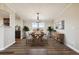 Bright dining room with hardwood floors and large windows at 43343 E Arkansas Pl, Bennett, CO 80102