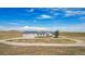 Exterior view of the property showcasing its ranch style, large lot, and serene surroundings at 43343 E Arkansas Pl, Bennett, CO 80102