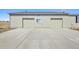 Two-car garage with attached driveway providing ample parking space at 43343 E Arkansas Pl, Bennett, CO 80102