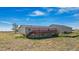 Ranch-style home with a large deck and an expansive yard at 43343 E Arkansas Pl, Bennett, CO 80102