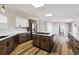 Modern kitchen with island and stainless steel appliances at 43343 E Arkansas Pl, Bennett, CO 80102