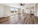 Expansive living area offers natural light, hardwood floors, and exterior views at 43343 E Arkansas Pl, Bennett, CO 80102