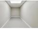 Unfurnished room with neutral paint, floors and lighting, providing versatility and space at 43343 E Arkansas Pl, Bennett, CO 80102