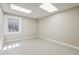 Bright room featuring grey floor and a window providing natural light at 43343 E Arkansas Pl, Bennett, CO 80102