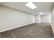 Unfurnished room with neutral paint, carpet and lighting, perfect for customization at 43343 E Arkansas Pl, Bennett, CO 80102