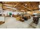 Large workshop with high ceilings, plenty of storage, and workspace at 43343 E Arkansas Pl, Bennett, CO 80102