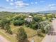 A captivating aerial view of the property showcasing rolling hills and mature trees at 6334 Cherokee Dr, Sedalia, CO 80135