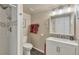 Nicely remodeled bathroom with updated vanity, mirror, fixtures and tiled shower at 6334 Cherokee Dr, Sedalia, CO 80135