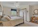 Bedroom features a traditional bed frame, closet, and natural light from a window at 6334 Cherokee Dr, Sedalia, CO 80135