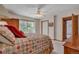 Comfortable carpeted bedroom features glass sliding doors leading to an outdoor deck at 6334 Cherokee Dr, Sedalia, CO 80135
