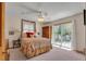 Cozy bedroom with ceiling fan, sliding glass doors to deck, and a comfortable carpet at 6334 Cherokee Dr, Sedalia, CO 80135