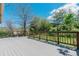 A spacious deck with a view of the grassy yard, perfect for outdoor relaxation and enjoying nature at 6334 Cherokee Dr, Sedalia, CO 80135