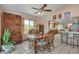 Dining room featuring tile floors, chandelier, large window, and adjacent view of the kitchen at 6334 Cherokee Dr, Sedalia, CO 80135