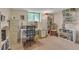 A well-lit home office with bookshelves and neutral decor, perfect for focusing on work or studying at 6334 Cherokee Dr, Sedalia, CO 80135