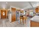Open kitchen with stainless steel appliances, tile flooring and adjacent dining area at 6334 Cherokee Dr, Sedalia, CO 80135