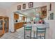 Kitchen area with breakfast bar, view of the dining room and ample counter space at 6334 Cherokee Dr, Sedalia, CO 80135