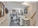 Basement laundry room with front loading washer and dryer, storage shelves and tile flooring at 6334 Cherokee Dr, Sedalia, CO 80135