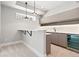 Modern bar area with a beverage fridge, sink, tile backsplash, and pendant lighting at 1500 S Elizabeth St, Denver, CO 80210