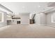 Spacious basement with a bar area, recessed lighting, and contemporary staircase at 1500 S Elizabeth St, Denver, CO 80210