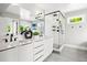 Contemporary bathroom with a glass-enclosed shower, double vanity, and modern fixtures at 1500 S Elizabeth St, Denver, CO 80210