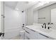 Bathroom featuring a shower and tub, white subway tile, floating vanity, and modern fixtures at 1500 S Elizabeth St, Denver, CO 80210