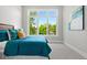 Bright bedroom featuring a large window, bed with decorative pillows, and neutral carpeting at 1500 S Elizabeth St, Denver, CO 80210