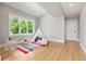 Bright bedroom with a large window, hardwood floors, and a playful decor at 1500 S Elizabeth St, Denver, CO 80210