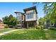 Contemporary home with unique architectural design, brick accents, and manicured lawn at 1500 S Elizabeth St, Denver, CO 80210