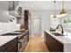 Gourmet kitchen showcasing professional-grade appliances, a center island, and designer finishes at 1500 S Elizabeth St, Denver, CO 80210
