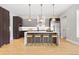 Bright kitchen with modern stainless steel appliances, a center island, and stylish pendant lighting at 1500 S Elizabeth St, Denver, CO 80210