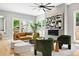 Comfortable living room features modern decor, a fireplace, and plenty of natural light at 1500 S Elizabeth St, Denver, CO 80210