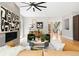Spacious living room with fireplace, modern decor, and large windows providing natural light at 1500 S Elizabeth St, Denver, CO 80210