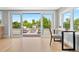 Sun-drenched living room featuring a modern desk area and expansive views of the outdoor patio at 1500 S Elizabeth St, Denver, CO 80210