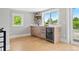 Chic bar area with a beverage fridge, elegant countertops, and ample cabinet space at 1500 S Elizabeth St, Denver, CO 80210