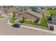 Aerial view of the home showcases the backyard, landscaping, and nearby neighborhood at 5230 Periwinkle Way, Henderson, CO 80640