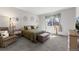 Cozy bedroom with natural light and neutral décor at 5230 Periwinkle Way, Henderson, CO 80640