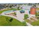 Aerial view of the community park featuring a barn, playground, and picnic shelter at 5230 Periwinkle Way, Henderson, CO 80640