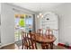 Dining area with sliding glass doors leading to the backyard at 5230 Periwinkle Way, Henderson, CO 80640
