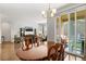 Dining room with an outdoor view and access to the living room at 5230 Periwinkle Way, Henderson, CO 80640